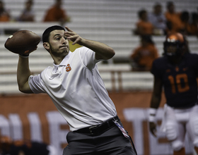 Football student managers balance academics, working for team