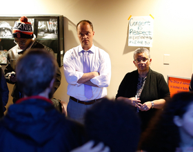 Syracuse University officials deliver copies of student code of conduct to protesters in Crouse-Hinds