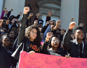 Syracuse University community members march against police violence toward black people