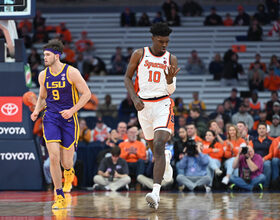 STILL GROWING: Naheem McLeod, SU's tallest player ever, is stretching into his new role