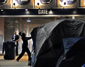 Penn State :  Normal Paternoville tailgate still goes on, but with somber tone after week's events