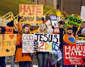 Protesters rally against Westboro Baptist Church before men's basketball game