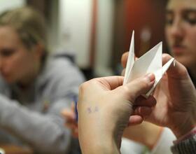 Students fold origami cranes in memory of Japan disaster