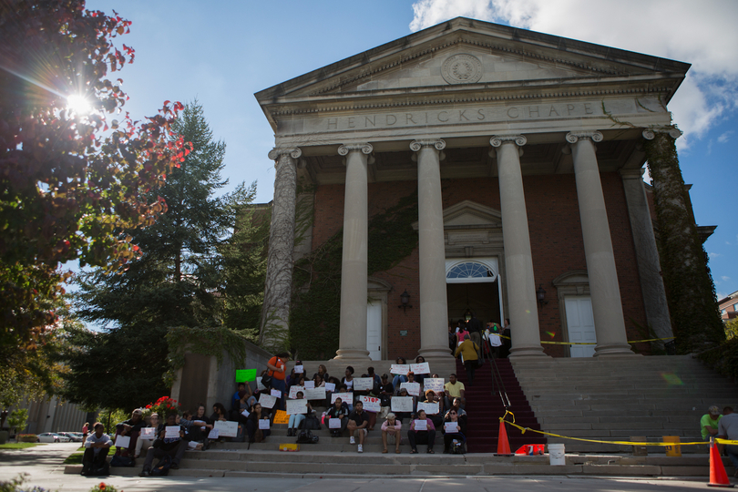 NAACP members stage silent protest outside of SU-sponsored diversity forum