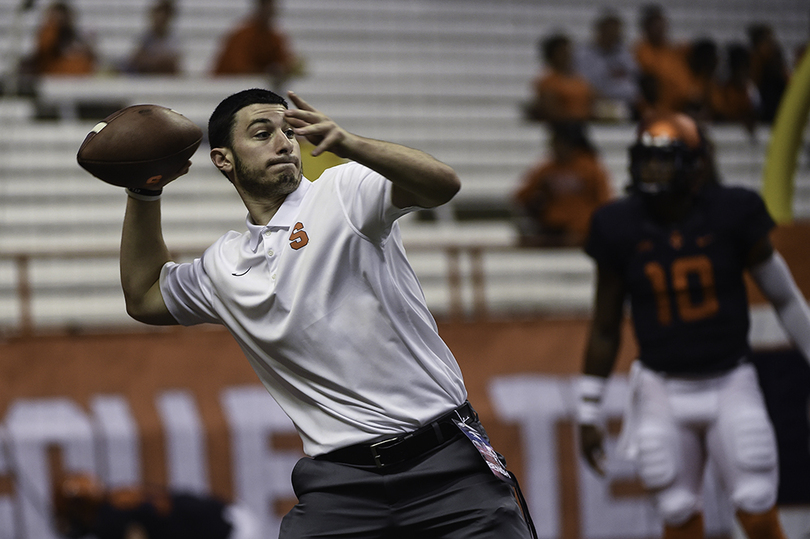 Football student managers balance academics, working for team