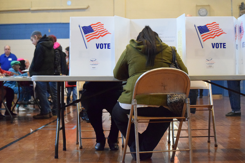 Syracuse University students ride bus to polls near campus to vote for 1st time