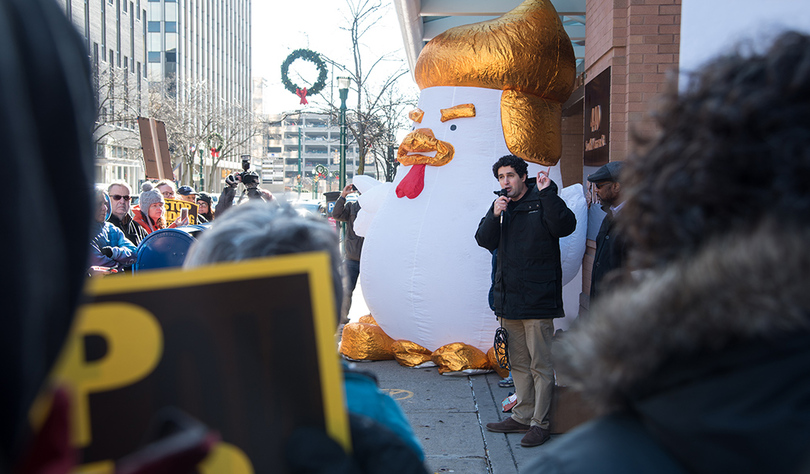 Protesters rally outside Rep. Katko’s office, bringing along a giant chicken resembling President Donald Trump