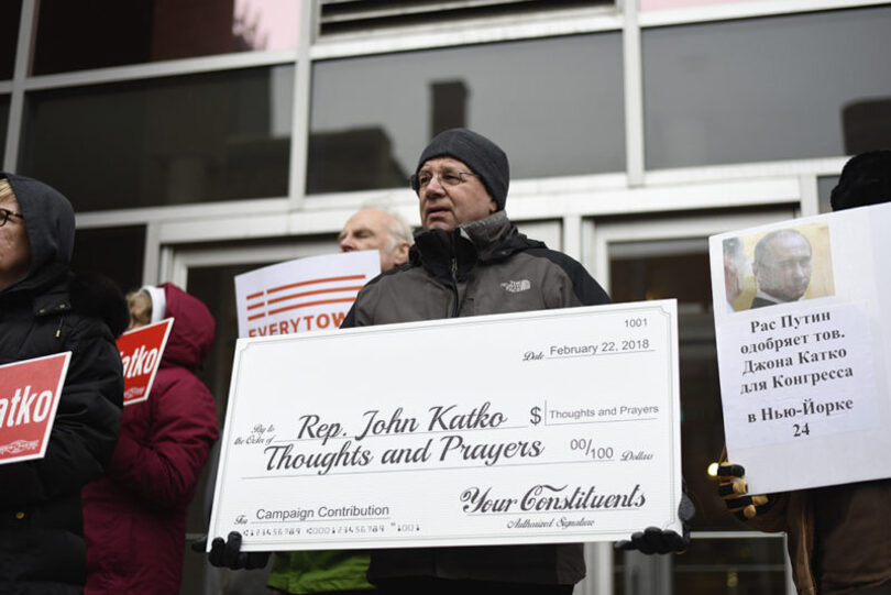 Activists deliver Rep. Katko a check for ‘Thoughts and Prayers’ at gun control protest