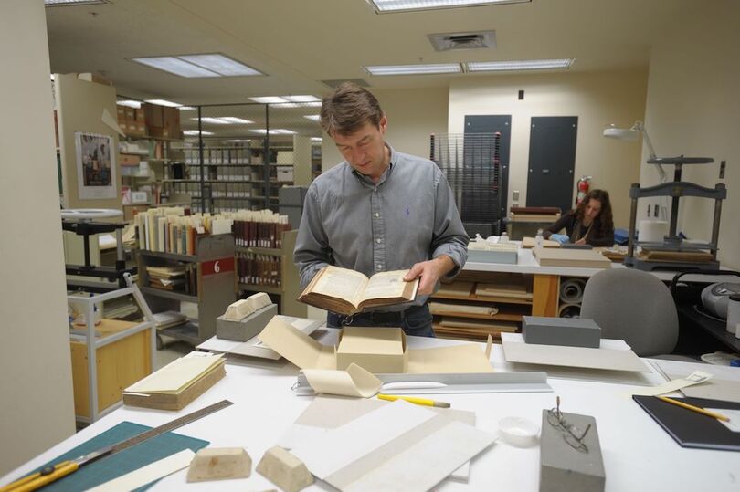 Artifacts in the libraries are deteriorating. SU delayed a plan to save them.