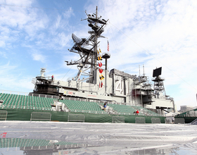 Battle on the Midway preparations continue on Thursday as ship is transformed into basketball court