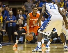 Gbinije contributes off bench in 1st game at former school Duke 