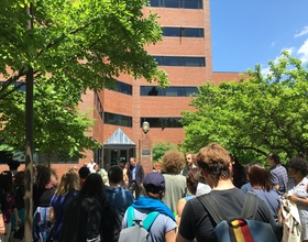 Syracuse University community members protest University Place promenade