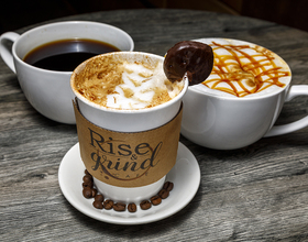 Rise & Grind Cafe offers specialty drinks and relaxed vibes