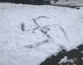 Swastika drawn in snow across from 505 on Walnut