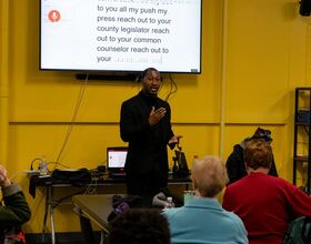 Maurice Brown addresses community housing concerns in town hall