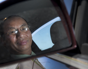 Backseat driver: Don Thatvihane advises SU athletes from his cab