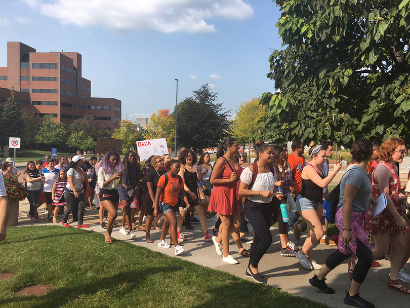 Students, alumni march across Syracuse University campus to protest uncertain future of DACA